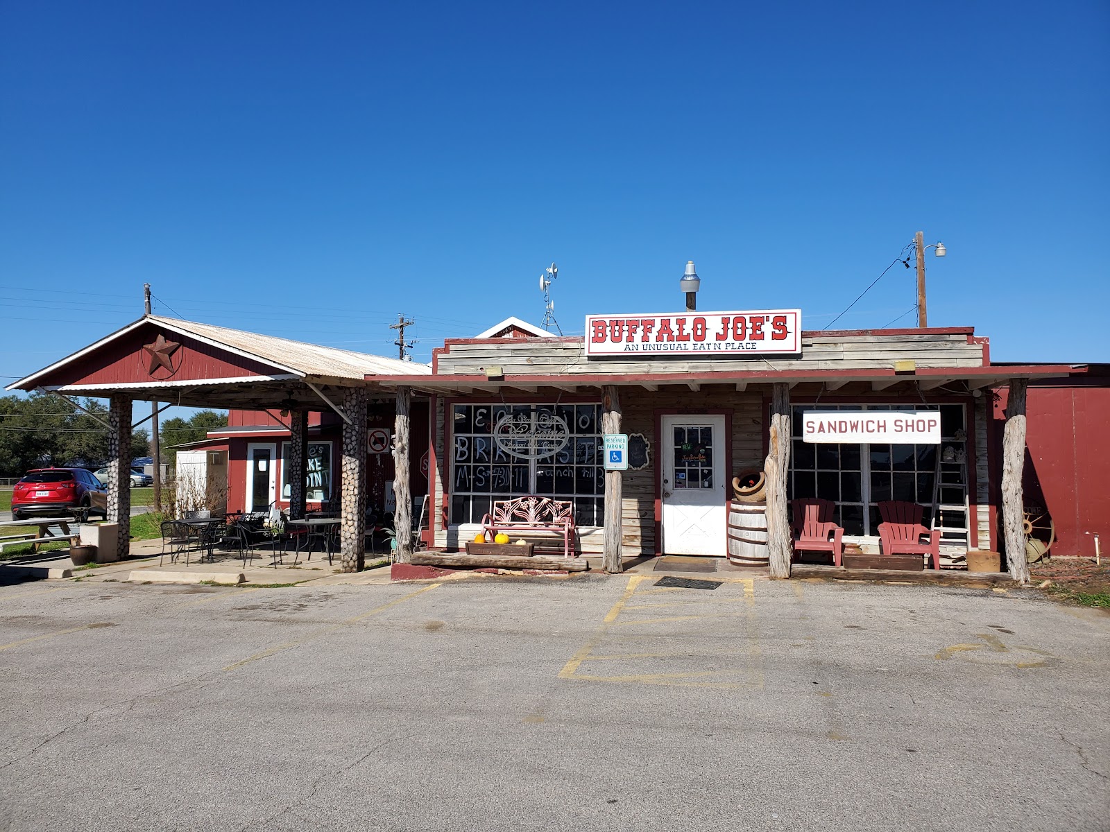Buffalo Joe's storefront on U.S. Highway 87 under a clear blue Texas sky