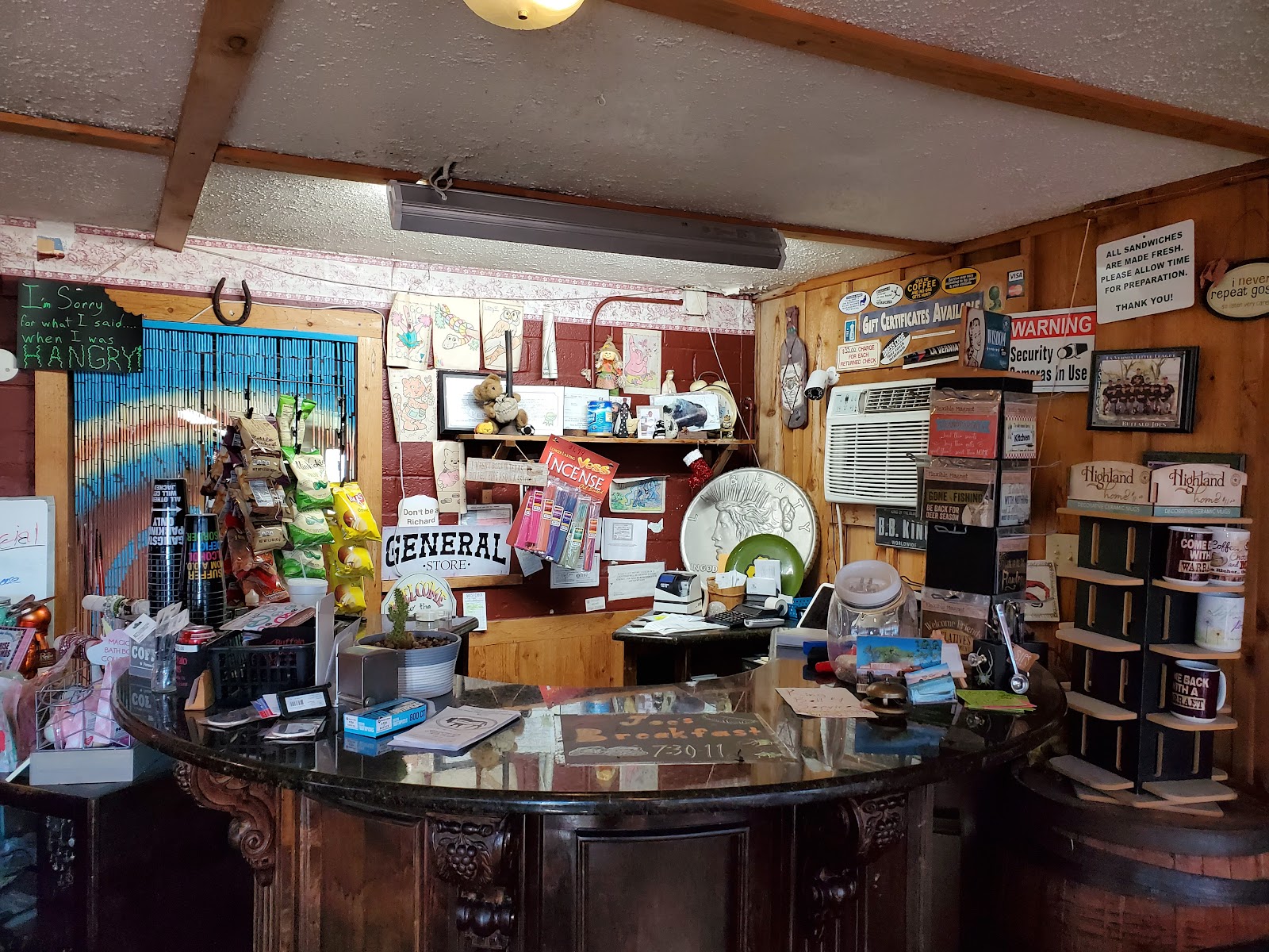 Rustic general store counter inside Buffalo Joe's decorated with local memorabilia